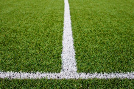 Limit lines of a sports grass field for Sports Backgrounds.  Selective focus.の写真素材