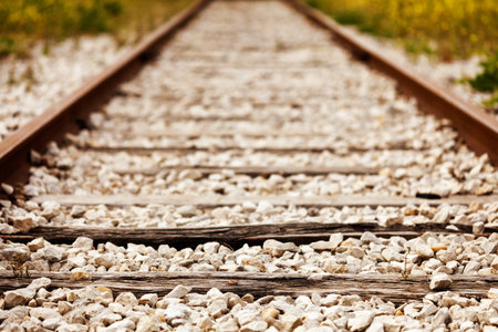 Old rusty railroad track with selective focus. の写真素材