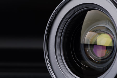 objective with lens reflections on black background