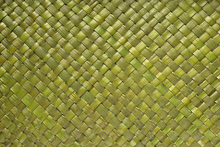 Original handmade green painted rattan strukture background.