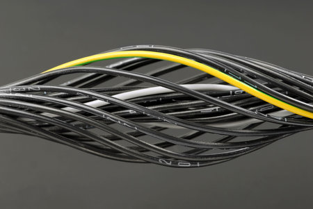 Some black numbered cables with one grounding cable.