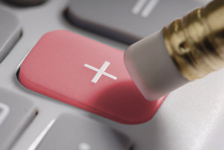 pushing the plus button on a calculator.の写真素材