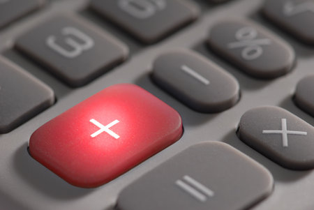 Macro detail of the illuminatted plus button on a calculator.の写真素材