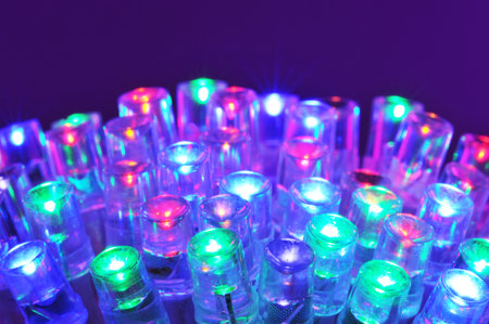 macro detail of some colored LEDs in purple spotlight