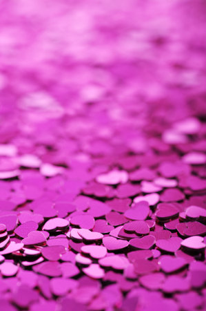close-up view of many small pink glitter heartsの写真素材