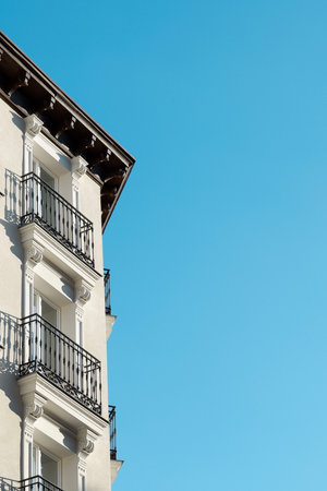 Minimal corner of classy building with windows and balconies downtown of Madrid, Spain.の写真素材