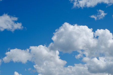 Voluminous white cloudscape on vivid blue skyの写真素材