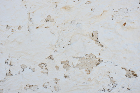 Old painted white wall. Ancient windmill cover. Consuegra, Toledo, Spainの写真素材