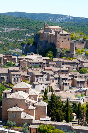 Vertical panoramic photo of medieval village Alquezar downtown at daytime. Skyline, layered landscape. Sierra de Guara Natural Park. Comarca Somontano de Barbastro, Huesca, Aragon, Spain.のeditorial素材