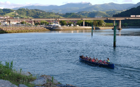 Orio, Basque country, Spain - July 8, 2021: female team practicing in traditional Basque water sport called trainera regattas, boat sportsのeditorial素材