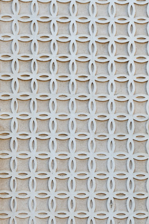 Patterned ornate made in sgraffito technique outside on the wall in Segovia, Spain