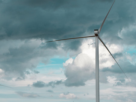 Wind turbine power station against dramatic cloudscape. Environmental background