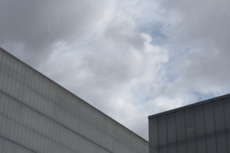 Lines of several office buildings on dark cloudy backgroud in Madrid, Spain. Urban architectureの写真素材
