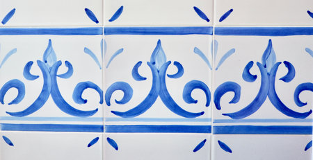 Simple tiles with rustic ornate of white and blue colour. Curly floral ornament. Traditional Spanish wall decorationの写真素材