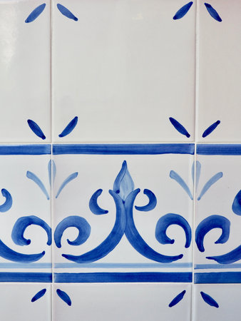 Ceramic tiles painted with blue curvy ornament. Spanish ornamental tradition common in southern part...
