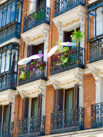 Colorful classy balconies on classical building in downtown district of Madrid near Plaza Espana, Spain. Vertical photos.の写真素材