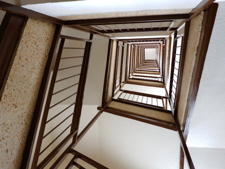 Looking up through staircase. Conceptual for vertigo and fear of heightsの写真素材