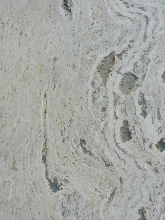 Beige stone surface of light colour on the street walkaway outside in Madrid, Spain.
