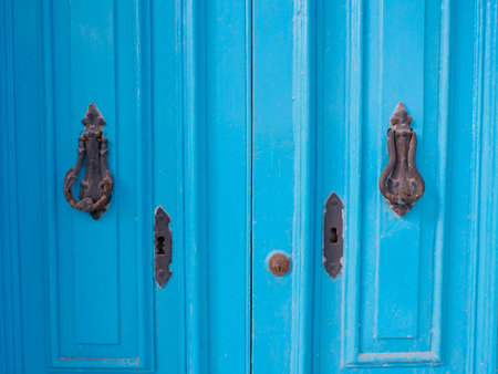 Vintage blue door with small metallic decorative elements. Maltese door surface.の写真素材