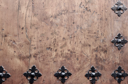 Wooden background with metallic decorated elements. Vintage backdrop.の写真素材