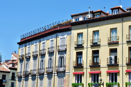 Classical vintage houses of light colours in the centre of Madrid, Spain.の写真素材