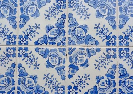 Tiled wall with traditional portuguese tiles of blue and white colours in Porto, Portugal.