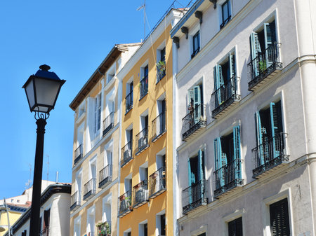 Old buildings of faded colours in Tirso de Molina, central district of Madrid, Spain.の写真素材