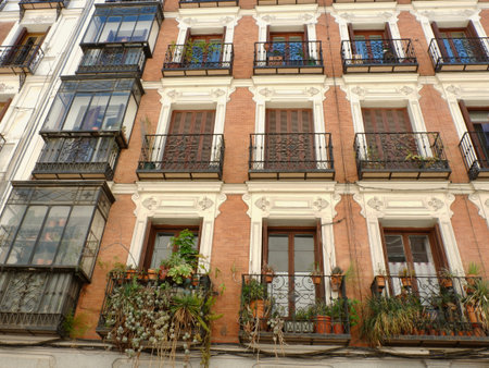 Old fashioned facade of the vintage building in Malasana district downtown Madrid, Spain.の写真素材