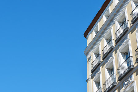 Corner of the rich classical building from outside in the central district of Madrid, Spain.の写真素材