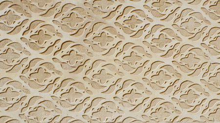 Vintage stucco ornate of beige colour on the wall outside downtown in Segovia, Spain.の写真素材