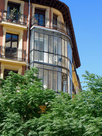 Rounded corner of old classical building in Anton Martin neighbourhood, center of Madrid, Spain. Vertical photos.の写真素材