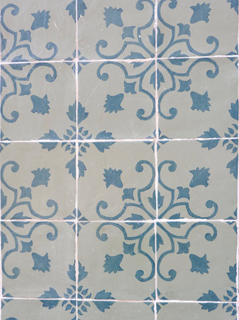Faded vintage tiles with floral ornate in authentic Portuguese tradition in Lisbon, Portugal.の写真素材