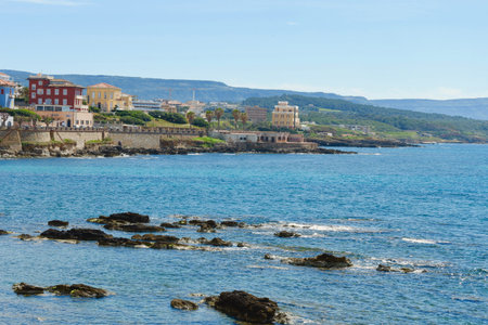 Panoramic view on the colorful sea bay with buildings of different color downtown in Alghero, Sardinia island, Italy.の写真素材