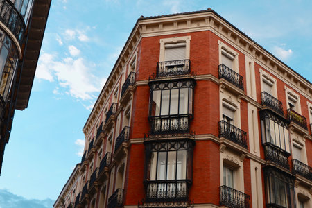 Classy vintage buildings with elegant black metallic balconies in the center of Madrid, Chueca district, Spain.の写真素材