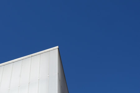 Lined architectural forms against clear blue sky. Architecture abstract background, modern design.の写真素材