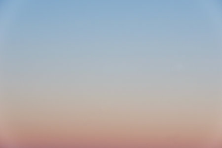 Abstract gradient sun dawn in the sky with blue and orange natural background. Horizontal photo.の写真素材