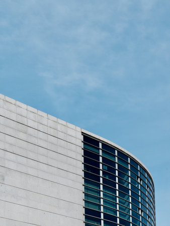 Rounded lines of modern architecture building in Madrid Spain vertical photo.の写真素材
