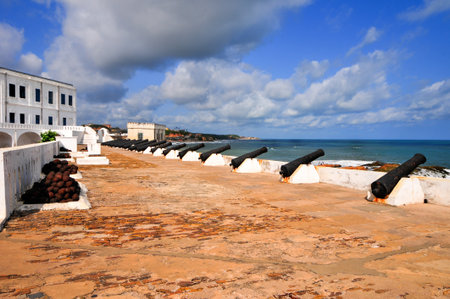 Cannons overlooking from Cape Coast Castle  Cape Coast Castle is a fortification in Ghana built by Swedish traders for trade in timber and gold  Later the structure was used in the trans-Atlantic slave trade のeditorial素材