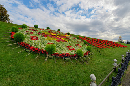Moscow written in flowers in cyrillic  Moskva  on Poklonnaya Hill, in Victory Park, Moscow  Church of Saint George  in the background のeditorial素材