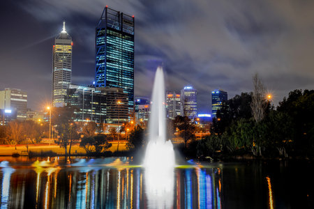 Skyline of Perth, Australia. View from John Oldany park. Australian skyscrapers and lights reflected in the water.の写真素材