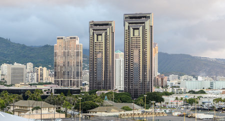 Skyline of Honolulu with residential towers against the misty hills.のeditorial素材