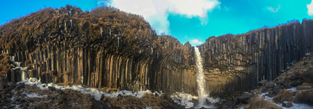 Panorama of Svartifoss Waterfall in Early Winter  Svartifoss  Black Fall  is a waterfall in Skaftafell in Vatnajokull National Park in Iceland, and is one of the most popular sights in the park の写真素材