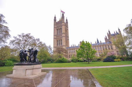 LONDON, UK - APRIL 26, 2012: The Burghers of Calais (Les Bourgeois de Calais), one of the most famous sculptures by Auguste Rodin. Victoria Tower Gardens in front of Parliament.のeditorial素材