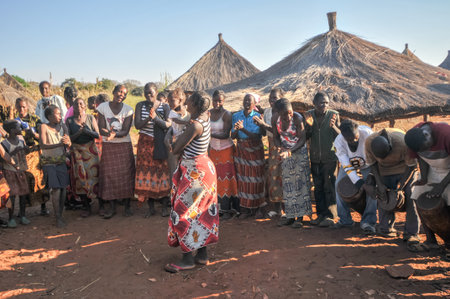 MIKUNI VILLAGE, ZAMBIA - APRIL 22, 2012: Gathering of villagers at Mikuni Village, Zambia.のeditorial素材