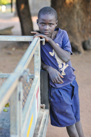 MIKUNI VILLAGE, ZAMBIA - APRIL 22, 2012: Boy from Mikuni Village, Zambia outside of Livingstone, Southern Zambia.のeditorial素材