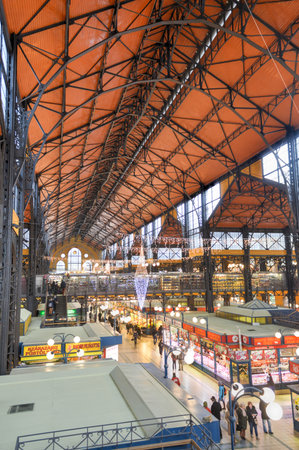 BUDAPEST, HUNGARY - DECEMBER 1, 2014: People shopping in the Great Market Hall in Budapest, Hungary. Great Market Hall is the largest indoor market in Budapest and was built in 1896.のeditorial素材