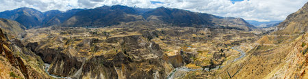 Panoramic view of Colca Canyon, Peru, South America. The Incas built farming terraces with ponds over the cliff. One of the deepest canyons in the world.の写真素材