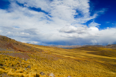 Road Cusco-Puno, Peru, South America. Sacred Valley of the Incas. Spectacular nature of mountains and blue sky.の写真素材