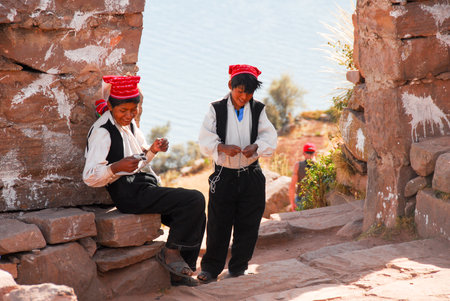 LAKE TITICACA, PERU - AUGUST 15, 2006: Young Peruvian boys around Lake Titicaca in Peru, South America.のeditorial素材