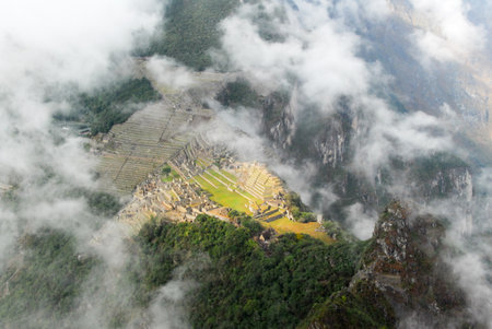 Machu Picchu, a Peruvian Historical Sanctuary in 1981 and a UNESCO World Heritage Site in 1983. One of the New Seven Wonders of the World. As seen through the clouds.のeditorial素材